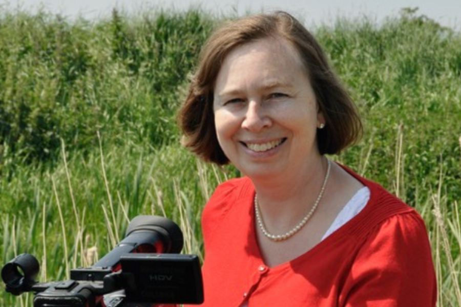 Head and shoulders - Wendy Pike with video camera